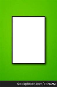 Black picture frame hanging on a green wall. Blank mockup template. Black picture frame hanging on a green wall