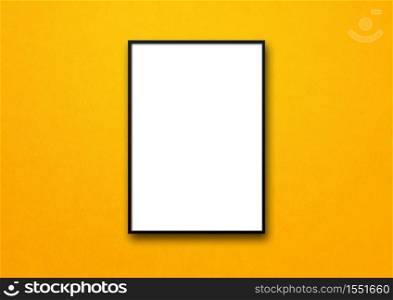 Black picture frame hanging on a yellow wall. Blank mockup template. Black picture frame hanging on a yellow wall