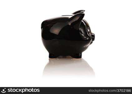 Black piggy bank isolated on white with soft reflection and shadow