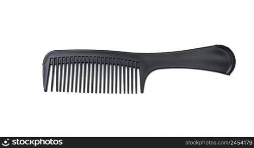 Black plastic comb on a white isolated background
