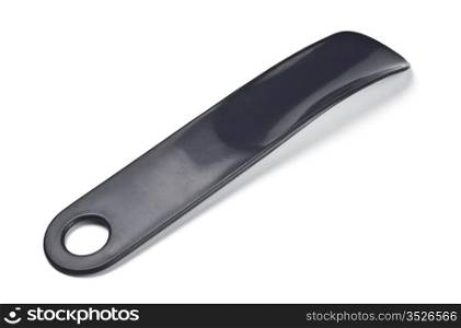 black plastic shoehorn isolated on white