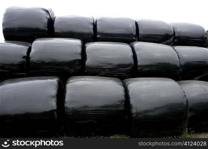 Black plastic wrap cover for wheat cereal bales outdoor