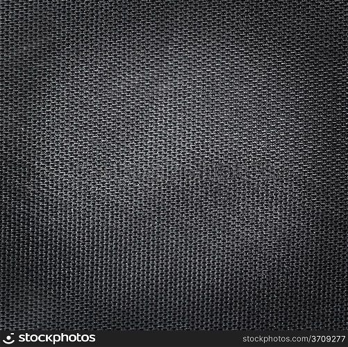 Black poliester texture background. Close up