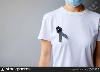 black Ribbon for Melanoma and skin cancer, Vaccine injury awareness month, grief and rest in peace. Healthcare and Racist concept