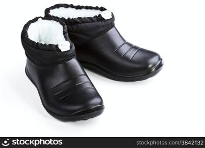 Black rubber female shoes on a white background
