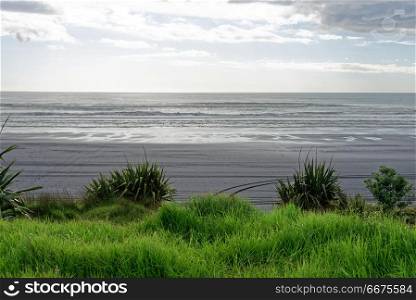 Black sand beach. Black sand beach along the Taranaki coast, New Zealand