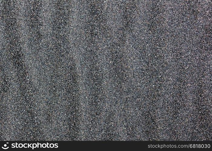 Black sand beach in Iceland, close-up of the sand