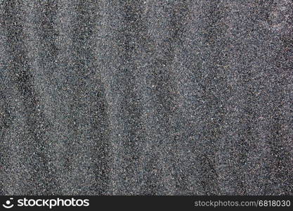 Black sand beach in Iceland, close-up of the sand