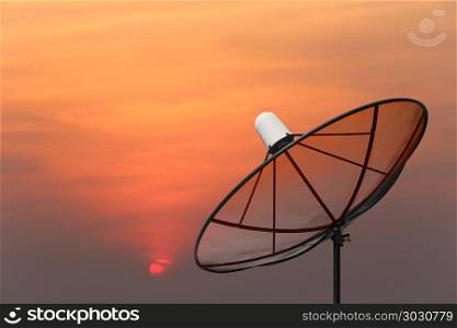 Black Satellite dish.. Black Satellite dish on sunset background.