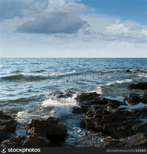 Black Sea coast, rocks, stormy sky (summer day).