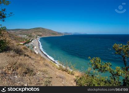 Black Sea coast view of the village of Rybachye on a summer sunny day, Crimea.