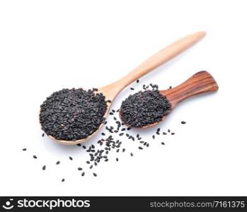 black sesame in a wooden spoon isolated on white background.