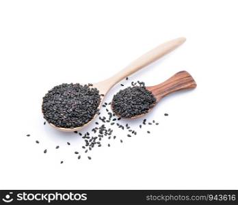 black sesame in a wooden spoon isolated on white background.