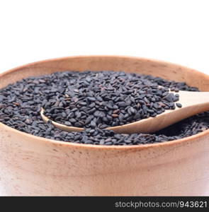 black sesame seeds in wooden bowl isolated on white background