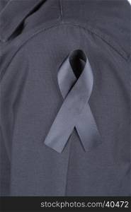 black shirt with black ribbons as a sign of mourning