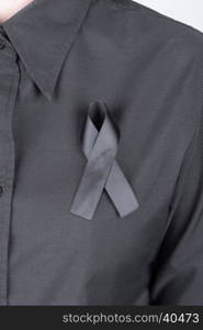 black shirt with black ribbons as a sign of mourning