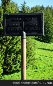 Black signon the border Lichtenstein and Austria