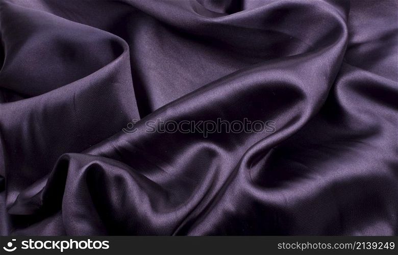 black silk background or texture. black satin
