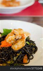 Black spaghetti with green mussel , fish eggs and shrimp