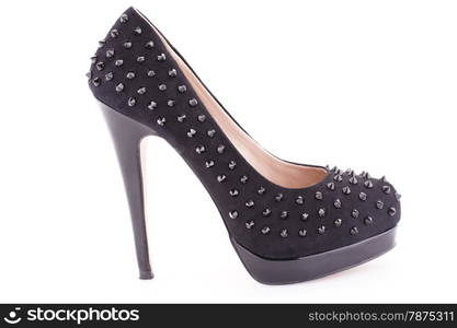 Black spiked shoe isolated on white background.