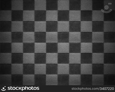 Black style background from textile with a square pattern closeup