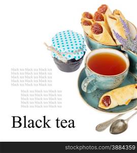 Black tea in the blue vintage cup and lavender flowers on a white background with space for text