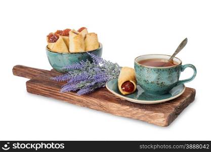 Black tea in the blue vintage cup and lavender flowers on a white background