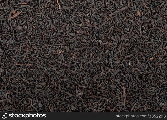 Black tea leaves background