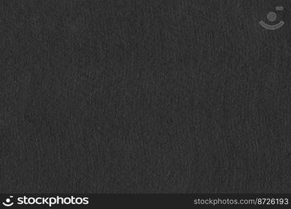 black texture for background. close up black paper embellishing colors dark black and faded white