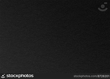 black texture for background. close up black paper embellishing colors dark black and faded white