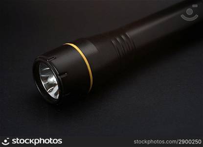 Black torch on dark background
