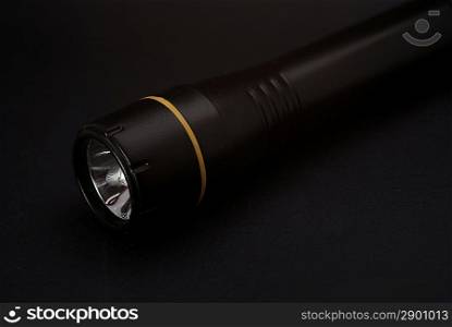 Black torch on dark background