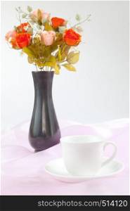 black vase flower on fabric pink background