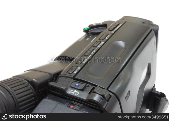 Black videocamera with buttons and switches on a white background