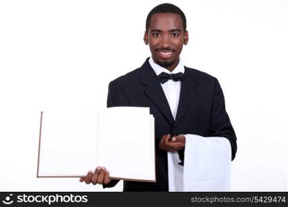 black waiter showing menu