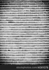 Black white brick wall texture pattern grunge background with vignette