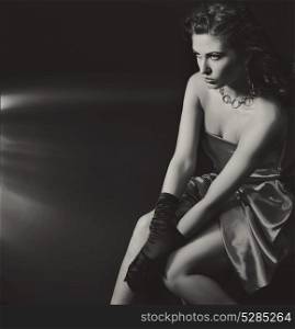 Black&white image of an elegant, serious woman