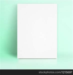 Black White paper poster lean at pastel green color studio room,Template mock up for adding your text.