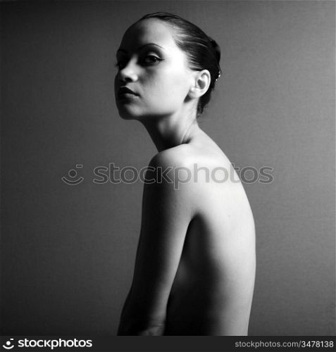 Black & white portrait of nude elegant girl. Studio photo.
