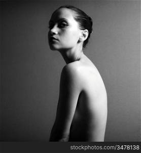 Black & white portrait of nude elegant girl. Studio photo.