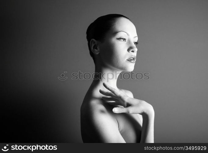 Black & white portrait of nude elegant girl. Studio photo.