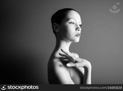 Black & white portrait of nude elegant girl. Studio photo.