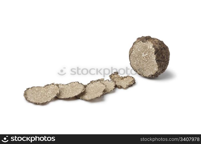Black winter truffle truffle and slices on white background