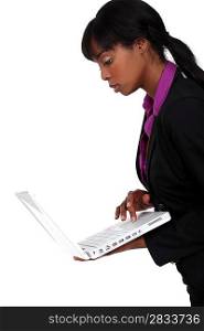 Black woman holding laptop