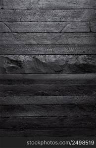 Black wood texture background. Dark wooden table top view.