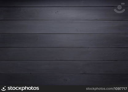 black wooden background as texture surface, top view