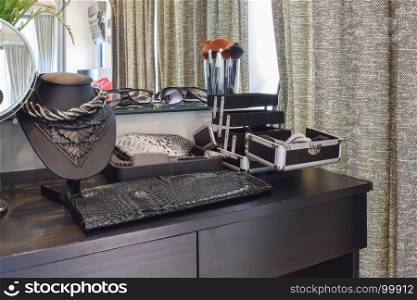 black wooden dressing table with accessories at home