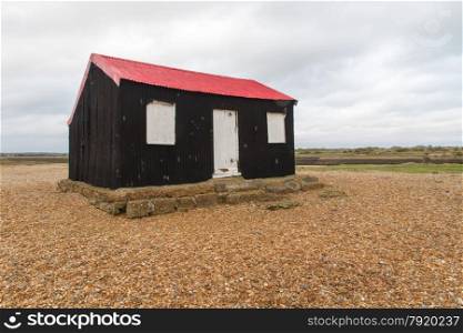 Black wooden shed, Master?s TARDIS in Doctor Who, Trial of a Time Lord, The Ultimate Foe 1986. Rye Harbour Kent, England, United Kingdom.