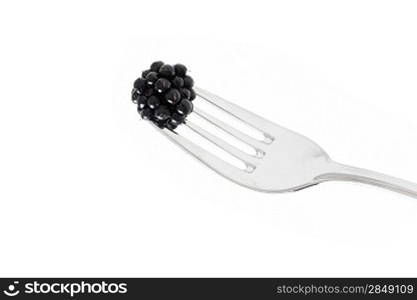 Blackberries on a fork ready to eat