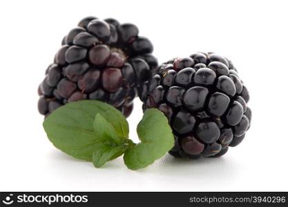 Blackberries with leaves isolated on white background.